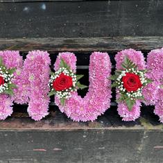 MUM TRIbUTE PINK MASSED WITH RED ROSES